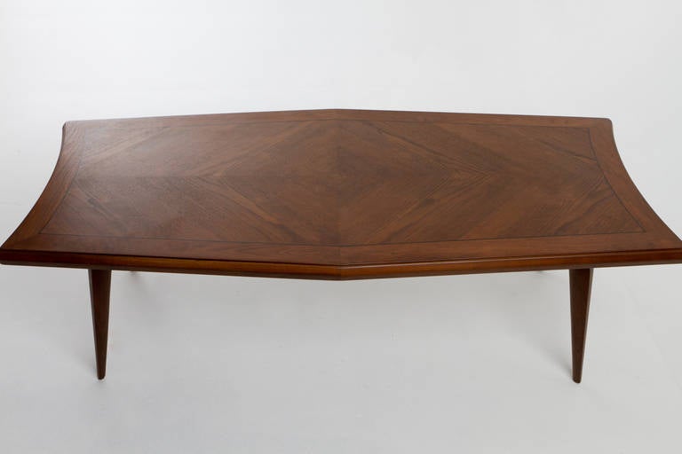 This table can be used as a dining table to seat six comfortably, as a game table, or as a desk, among other uses that your imagination can conger up.  A beautiful solid sculpted walnut leg table with diamond pattern book matched top. Beautifully