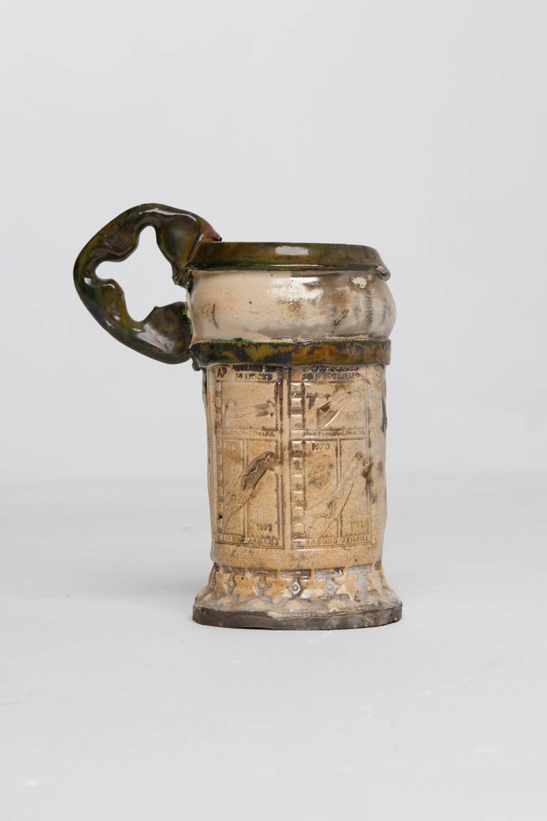 Erik Gronborg tan mug with Dodge Charger and stock market motifs