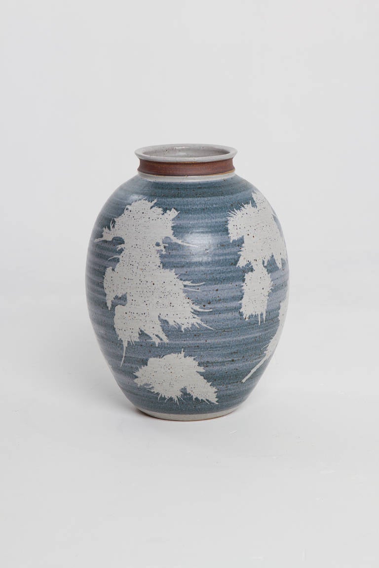 Great stoneware vessel with blue and white splotches.  Nice unglazed neck.