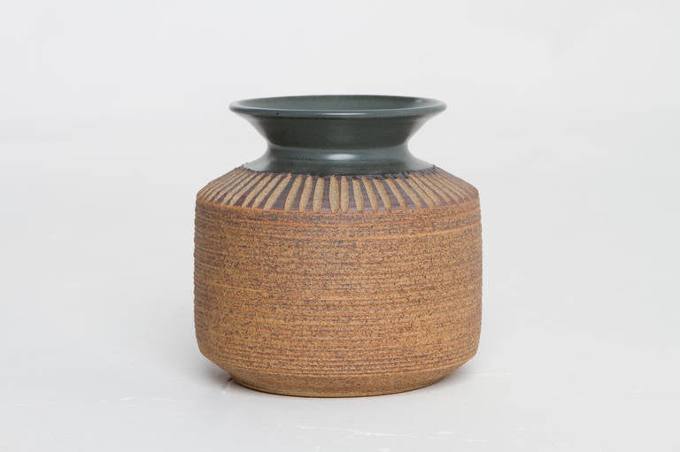 Nice scraffito work on this hand-thrown stoneware ceramic vessel with green glaze.