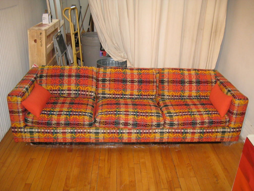 Brightly colored orange upholstered couch. Hard body, soft cushions... super-comfy. <br />
<br />
Stunning! <br />
<br />
Repeated 