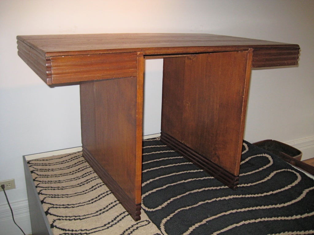 Very nice two-drawer desk was custom made for Ilonka Karasz's house in Java. Teak, with normal wear due to age, but in great shape, with a warm finish. Seen in photo of interior of house in 