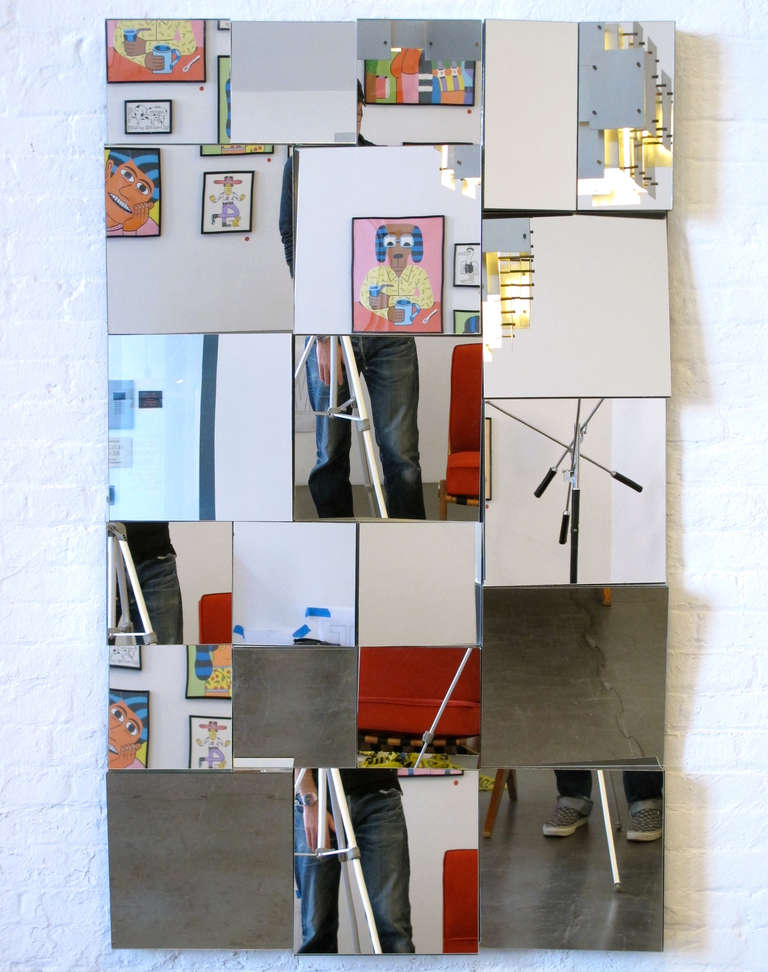 Large, glamorous, and dramatic Neal Small cubist mirror composed of 21 individual mirrors set at different angles.