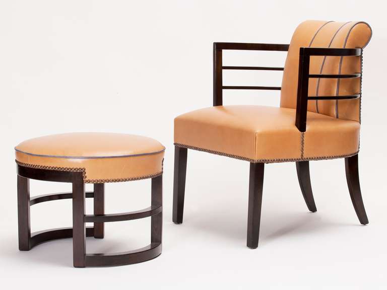 Rare Gilbert Rohde chair and ottoman in leather and stained mahogany from Herman Miller's 1939 Art Deco furniture collection. The chair is pictured in the catalogue and is titled 