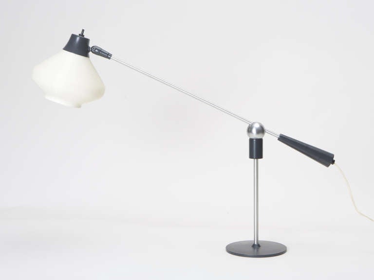 Adjustable steel and aluminium lamp with "Rotoflex" shade and magnetic swivel stand designed by Gilbert Watrous for Heifetz. This lamp is in "deadstock" condition, having never been used before.
