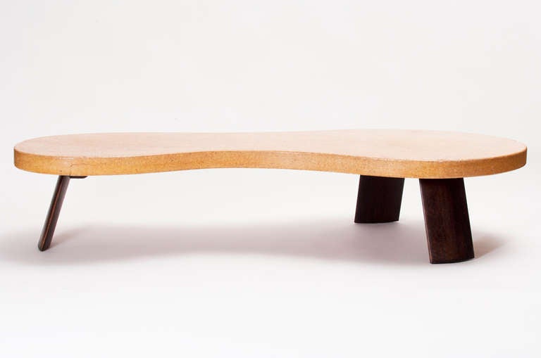 Rare biomorphic cork cocktail table with mahogany legs by Paul Frankl for the Johnson Furniture Company in original condition.