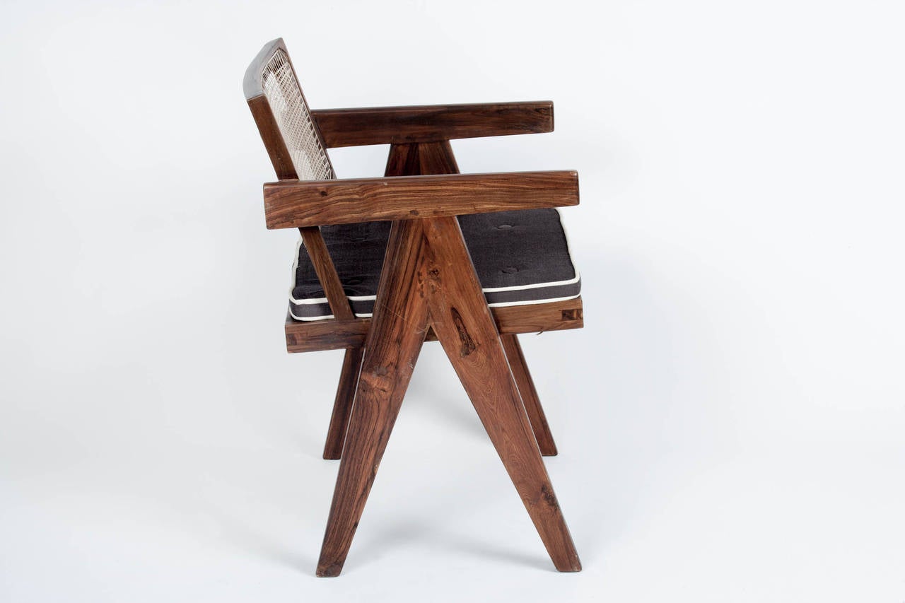 Pair of original teak and cane PJ-SI-28-B model armchairs circa 1960, with cushions, designed by Pierre Jeanneret for the famous Modernist capital city of Chandigarh, India, designed by Le Corbusier, Jeanneret and their team.