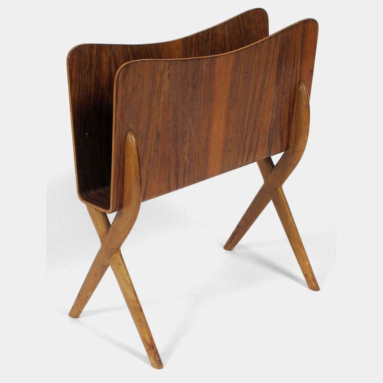 Beautiful and unusual bent rosewood magazine rack with elegant wood X-base in the manner of Ico Parisi.