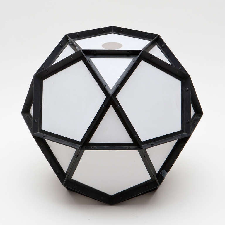 Interesting polyhedra form lamp in painted aluminum and fiberglass paper from the eccentric New York City designer and artist. Can hang or be placed on a table, even the floor. Signed.