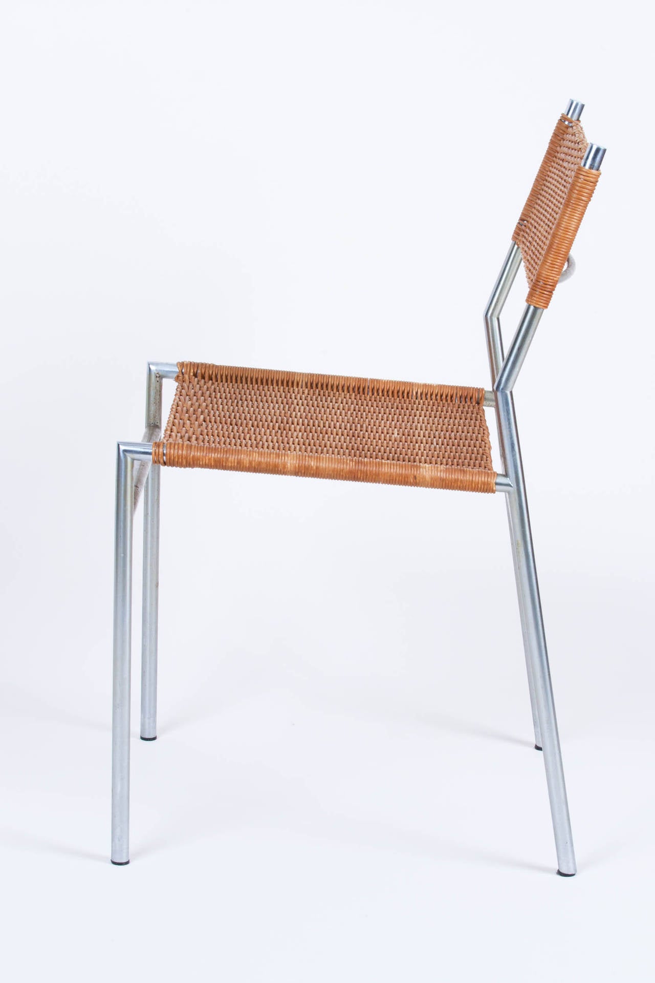 Tubular chrome frame chairs with rattan back and seat. Designed by Martin Visser for spectrum Meubelen. Two available.