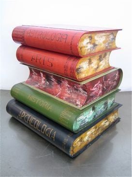 Painted metal oversized books of astrologia, arts, historia, archeologia and Dante. Top opens for hidden storage.