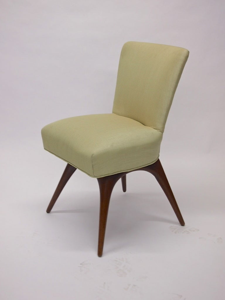 Pair of chairs were designed by Vladimir Kagan and produced by Kagan Dryfis in 1956 the chairs were covered in a Holly Hunt fabric on seat and back and supported by four splayed mahogany.