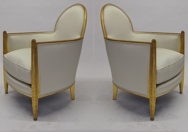 Pair of chairs by Paul Follot in gesso applied to wood and finished with gold leaf. These are a fine example of French Deco with fluted front legs that have a slight arch and rest on ball feet all hand done. Having been owned by one family the