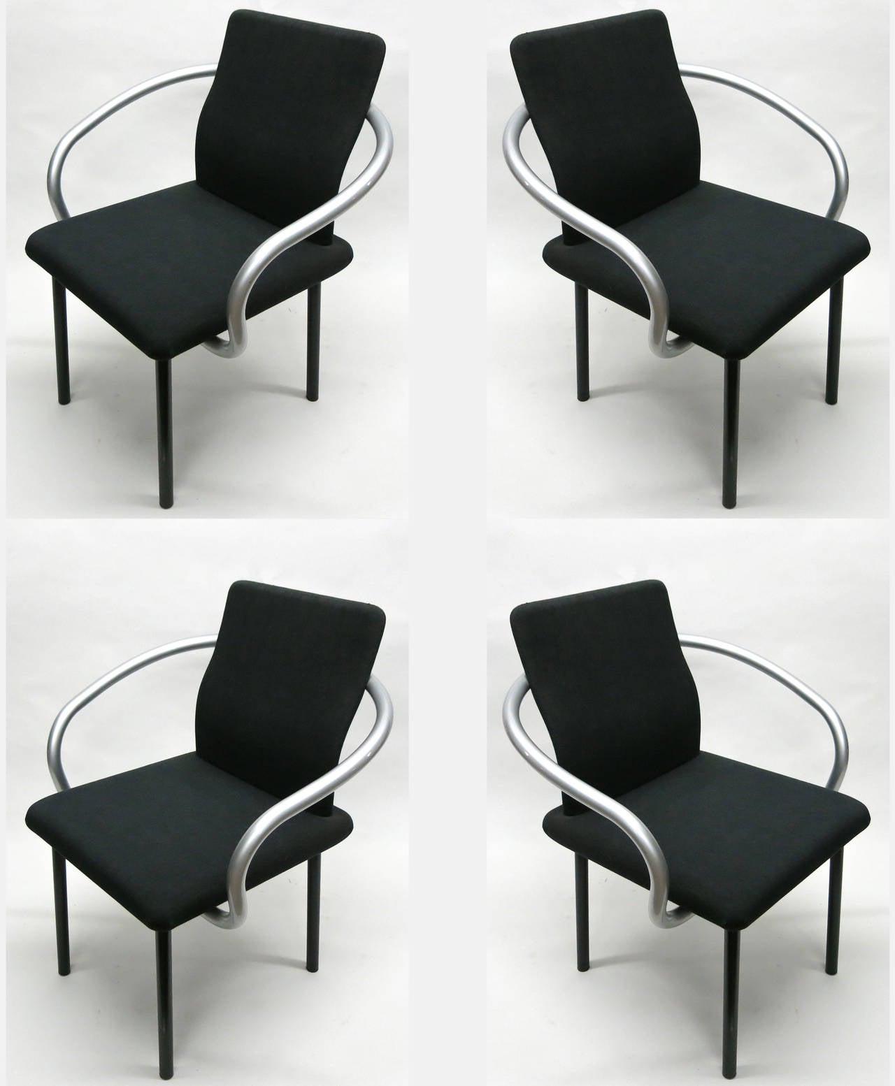 Set of six Mandarin chairs with original black fabric and grey metallic arms each with original labels underneath read Ettore Sottsass for Knoll International,
1990.