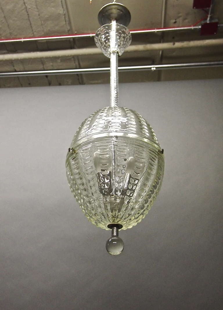 Pair of ovoid shaped ceiling lights by Barovier with original glass and canopies. Each light has three sockets within the dimensional glass which have been changed to US current.