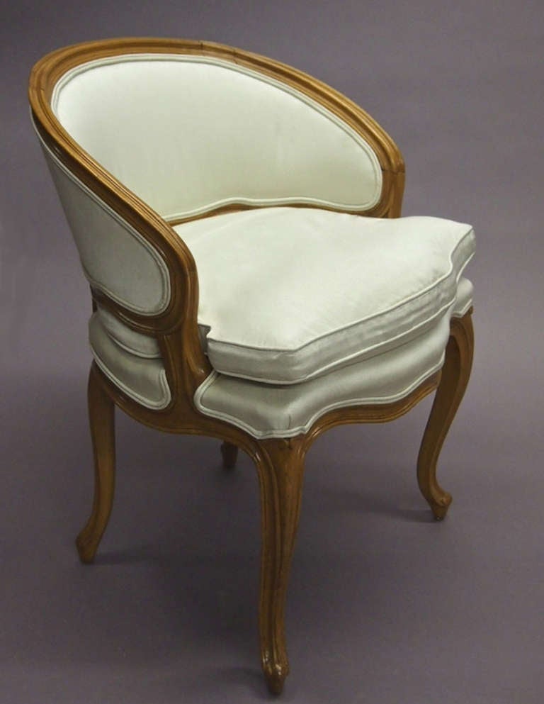 Single chair is a 1960's production of a Louis XV style boudoir chair done by Carlhion of Paris. Its rounded back and seat are upholstered in a Holly Hunt fabric. The chair was purchased in Chicago and said to have come from the estate sale of a