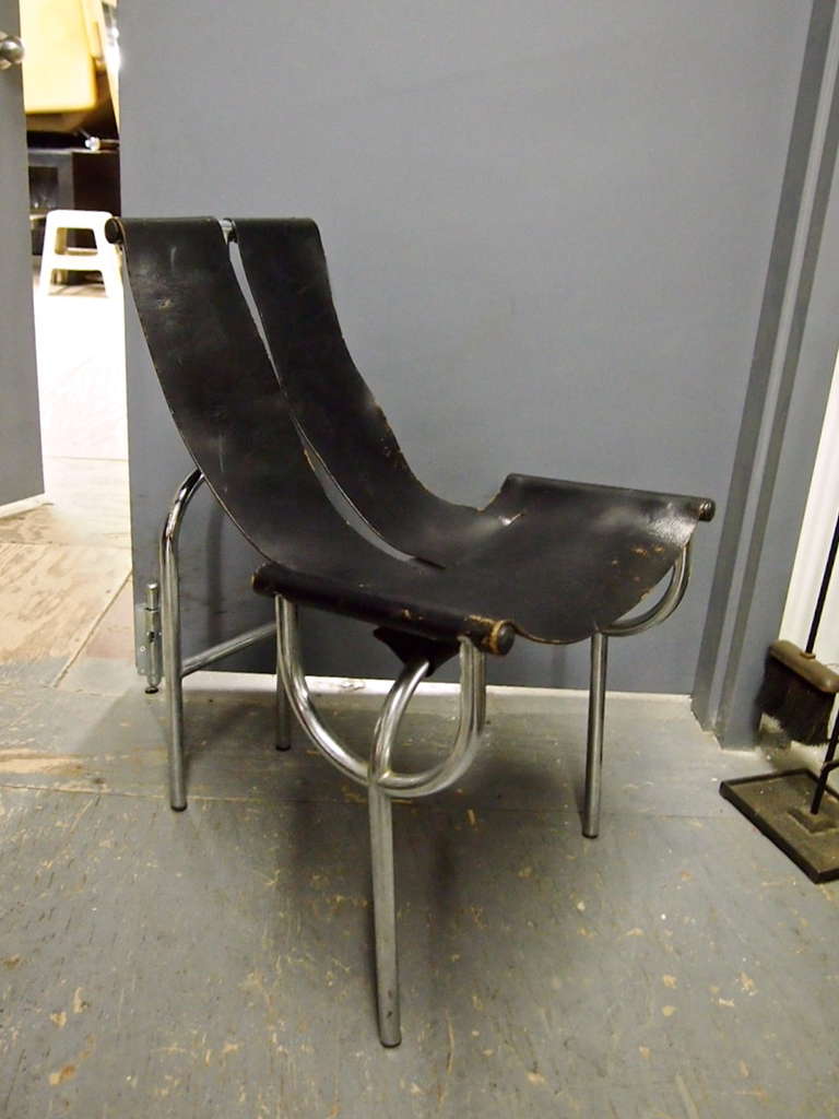 Pair of chairs in tubular chrome plated steel that support original black leather seat and back. Designed and fabricated in Italy, 1968.
