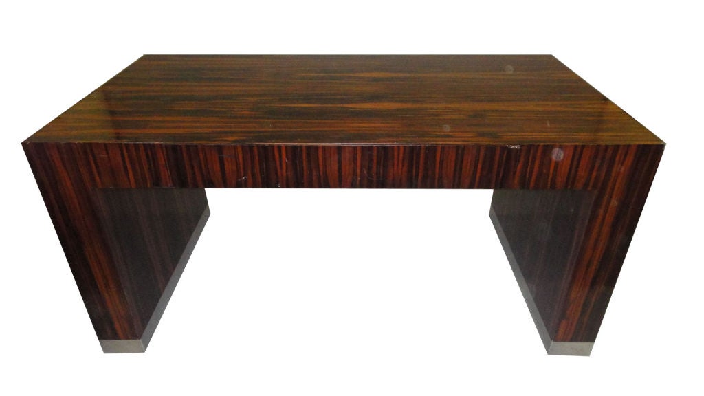 Partner's desk in Macassar ebony veneer with a stainless steel border on the bottom.<br />
Atelier Viollet metal tag.
