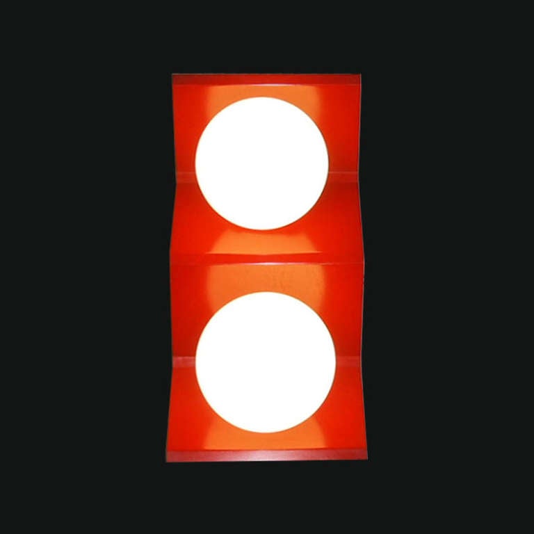 Pair of lights each with two globes in white cased glass supported by a rectangular mounting plate all in orange enameled metal. Wiring has been updated. Each globe has one standard American socket that can handle 100 watts if needed.
