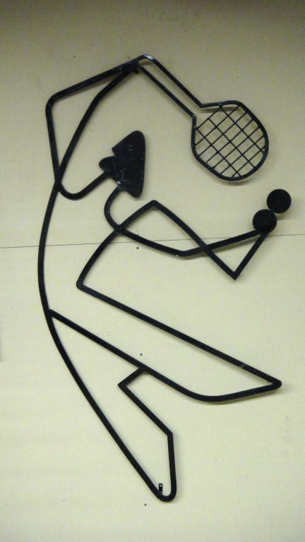 Wall sculpture of a tennis player in enameled metal by Frederick Weinberg.