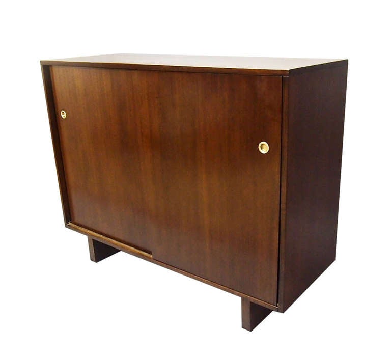 One made for lady's one made for gentleman both have sliding doors with brass hardware that reveal drawers and space on each side that differ in each cabinet. The difference is in the interior drawer size tie rack and open space for shoes. The