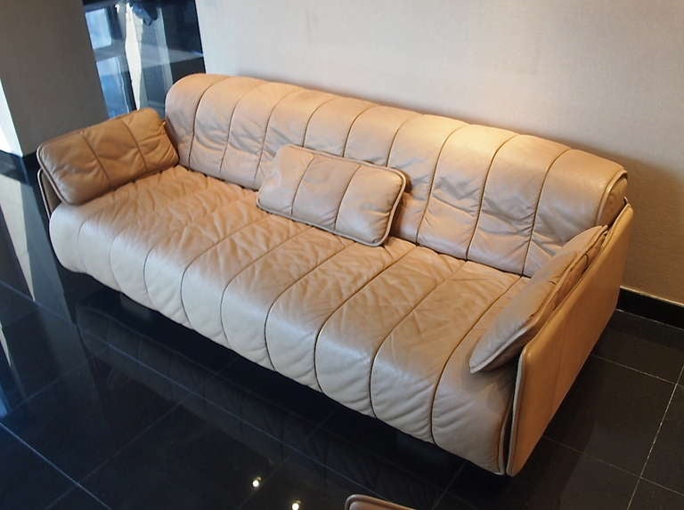 This sleep sofa was purchased in 1986 and had only one owner who placed the sofa and matching lounge chair in a spare room of the apartment. The arms pull forward and the seat back unrolls to form a bed. Original labels still intact.