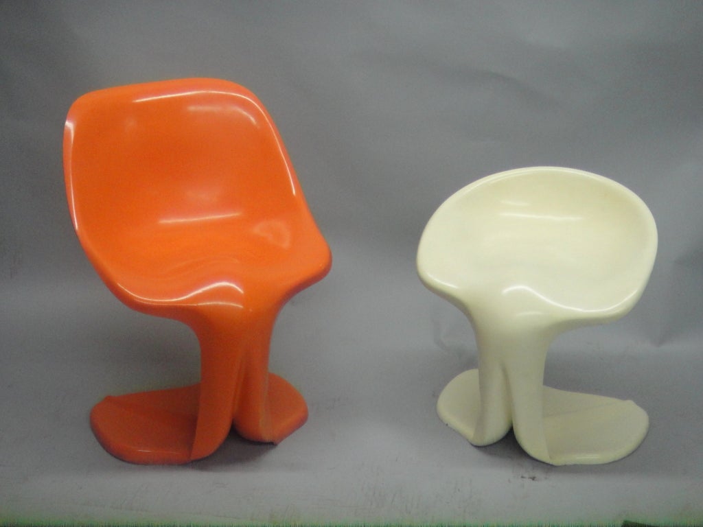 Pair of chairs in enameled fiberglass designed in 1964 by Jean Dudon who produced a   