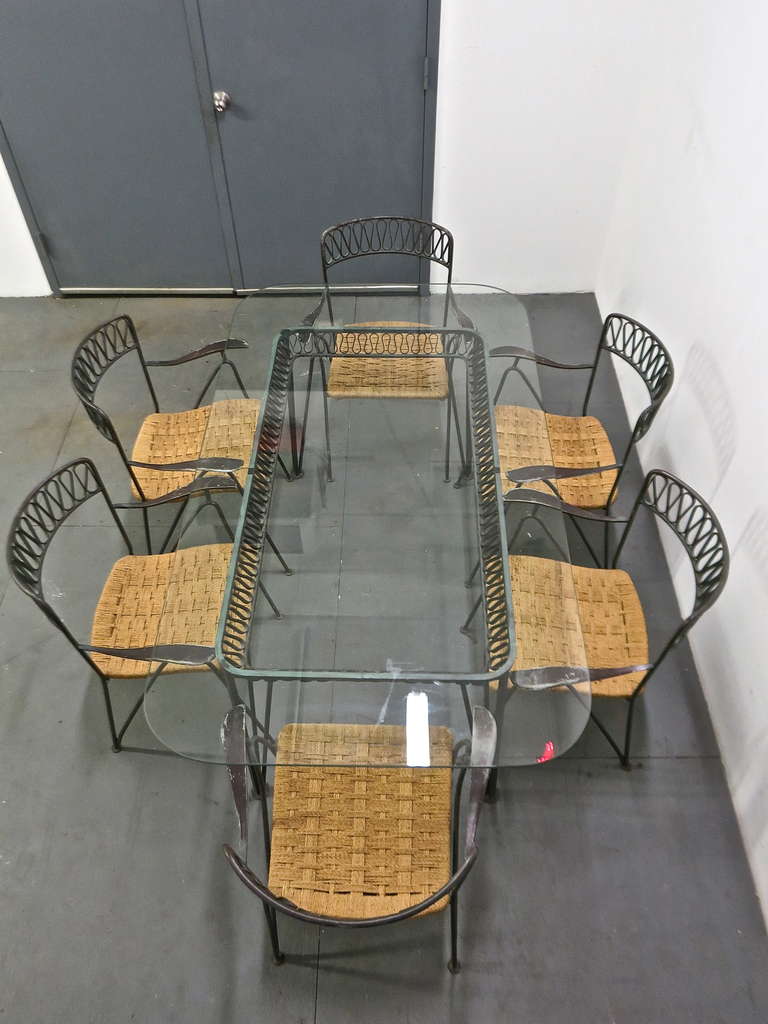 Glass Top Dining Table with Six, chairs two arm and four side, from Salterini's modern line. This set is from the 