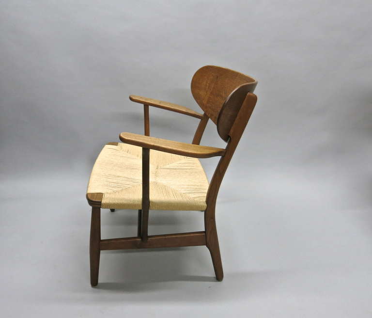 Oak Pair of CH-22 Easy Chairs by Hans J. Wegner, Denmark, circa 1955