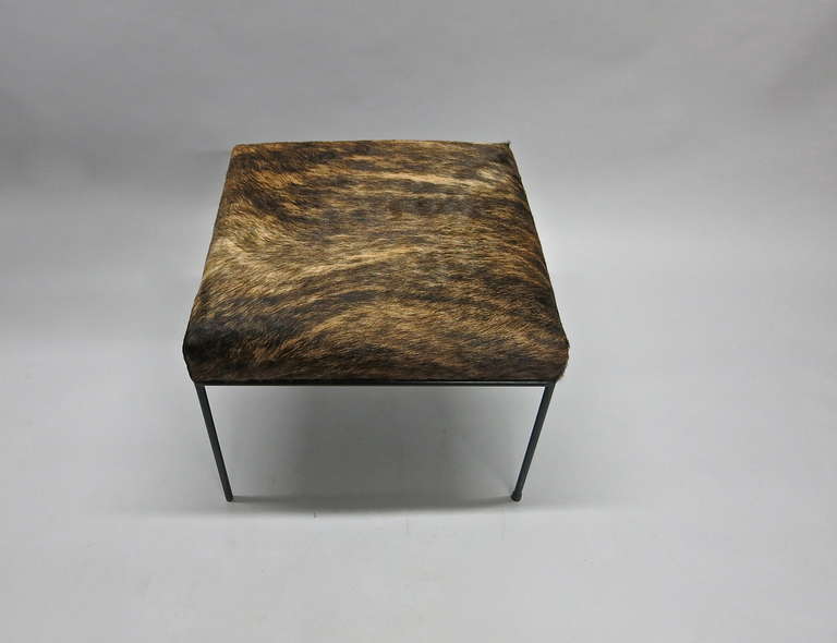 Black enameled wrought iron stool design by Paul McCobb and upholstered in brindle, 'hair-on' cowhide.