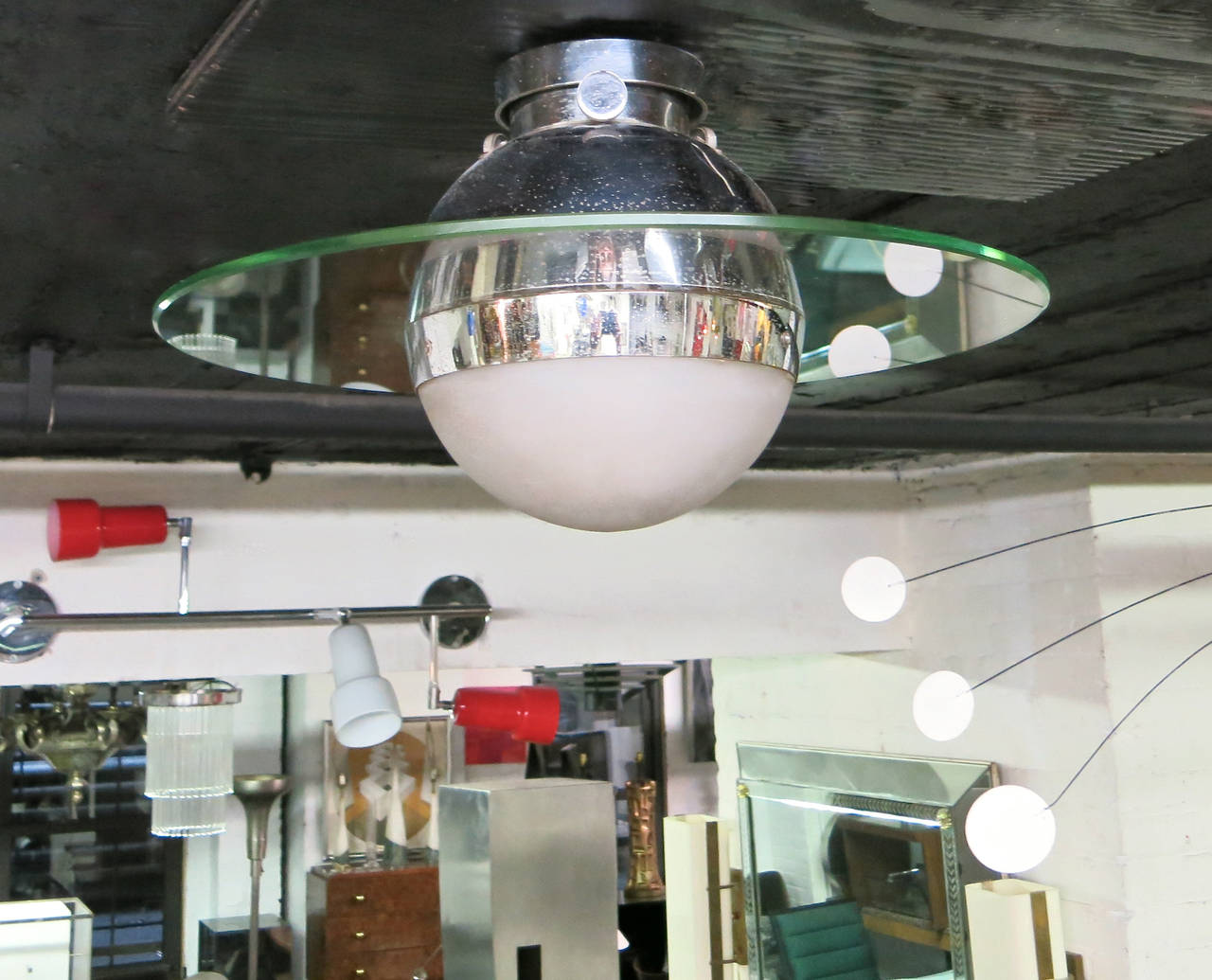 An original 1930's French ceiling light, in excellent vintage condition, has a demi-lune-shaped frosted glass shade, nickeled fittings, and an encompassing clear glass disk. 