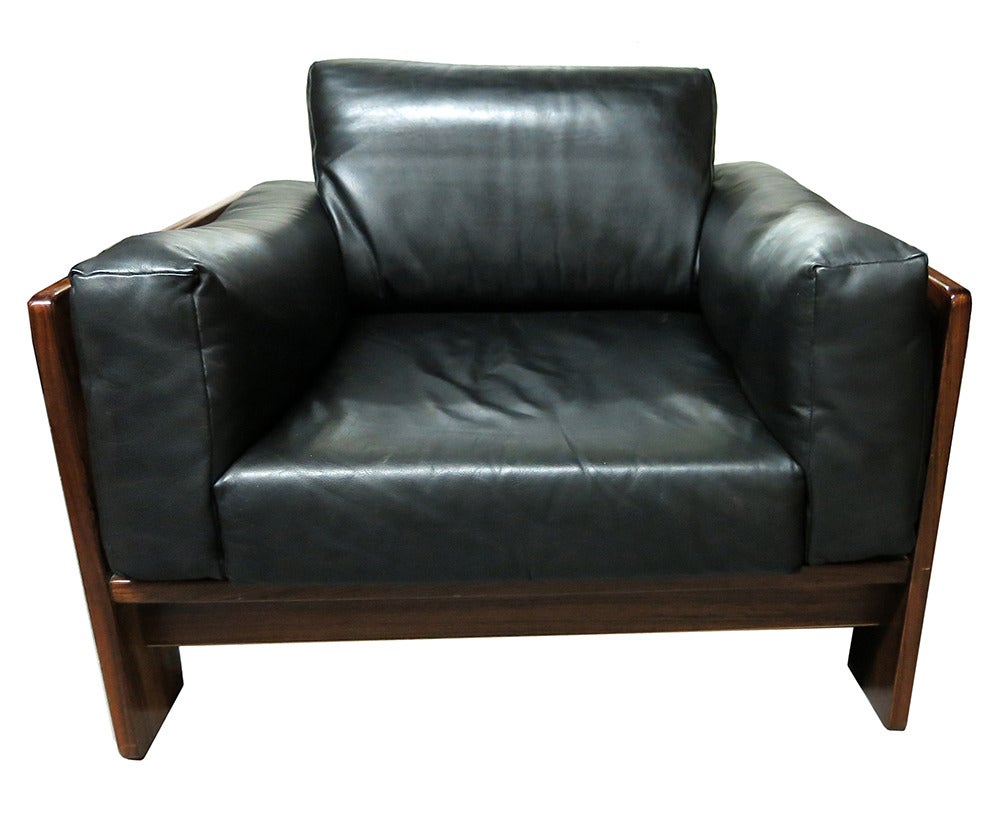Lounge chair has a rose wood frame with four large leather cushions that interlock inside the frame. An interlocking rose wood frame support four thick leather cushions. 
Documented 1000 chairs - Taschen 1997 pg 409