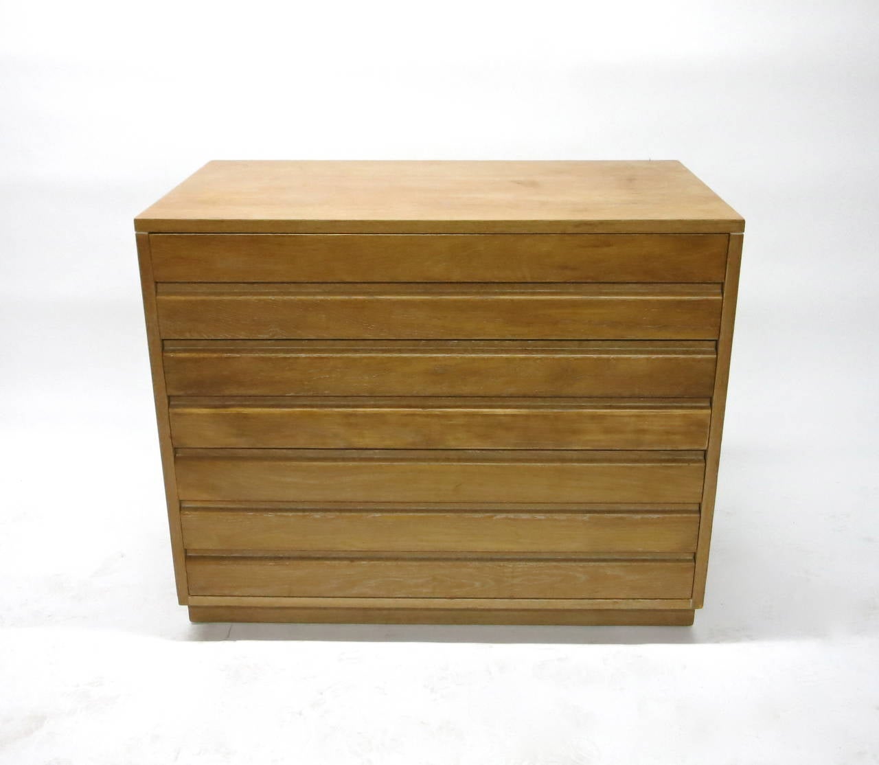 Cabinet has three drawers with the bottom being largest.The top drawers have dividers and the original Grand Rapids logo. Was originally finished in grey oak and recently changed to limed oak.