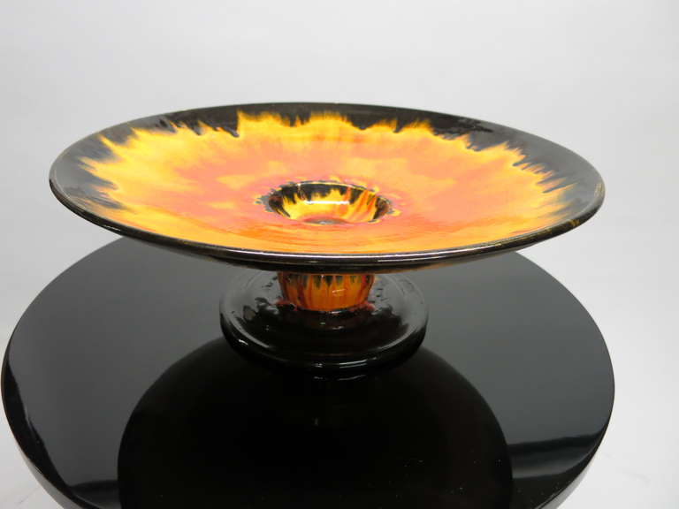 Ceramic Bowl in shades of orange to yellow flamed colored with black base in original condition