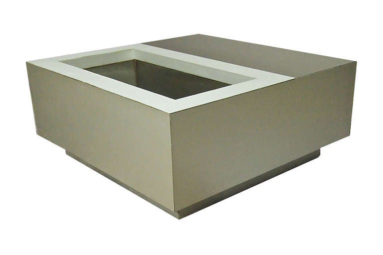 Pair of tables with smoked mirrored tops and stainless inserts that were originally used as planters. The tables are on casters and can be moved easily without lifting