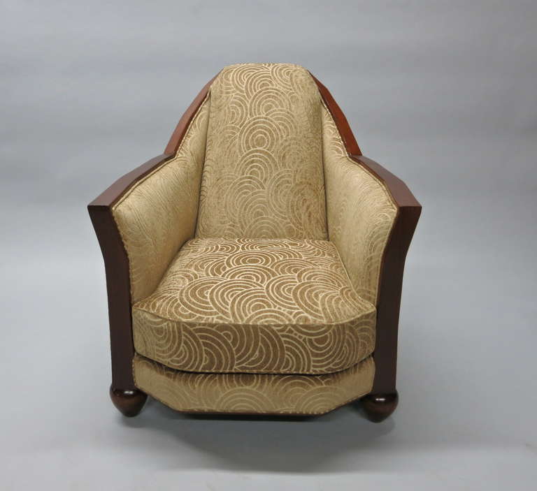 French Deco Chair has been refinished and upholstered with photos in its original condition. A vintage fabric covers the rounded back along with the seat back and cushion trimmed with dark stained wood