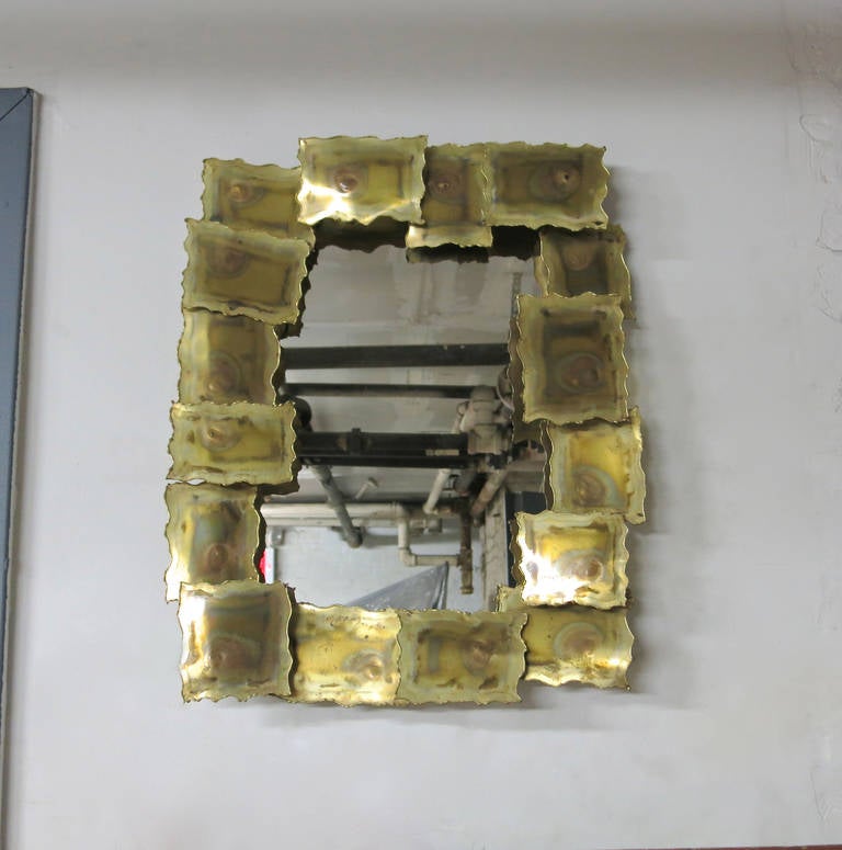 Mirror is framed by rectangles of metal with an acid washed patinated applied to the front of the metal. The back has existing hardware set up to mount horizontal or vertical