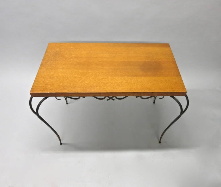 Table has a fruitwood top supported at each corner by decorative arched legs that meet at the bottom with a graceful curve to rest on a ball foot.