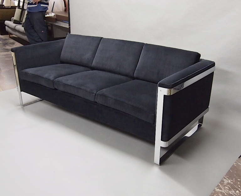 Vintage Sofa has been upholstered in black cotton velvet and is supported on each side by a polished steel legs. The Sofa maintains some signs of age but is in great condition!!! 
Sofas came from a hotel lobby and there are three available in total