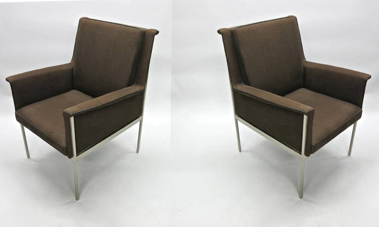 Pair of chairs with a nickel plated frame, legs that are 1.5 cm square thick and 3.5 cm thick side stretchers that support a recently reupholstered seat in brown linen with dark brown leather piping.