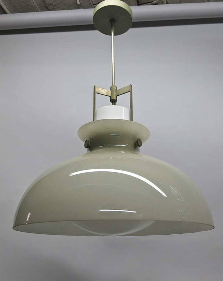 Ceiling fixture is made of two glass shades with nickel fittings. The inside white cased glass shade defuses the bulb and rises through the matt green outer shade both supported by a nickel frame that was designed to hold both pieces. Not much known