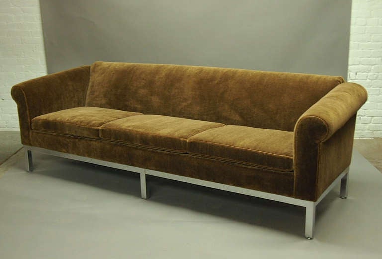 Vintage Sofa has a polished steel frame that supports newly upholstered mohair fabric with brown leather welting in perfect condition.