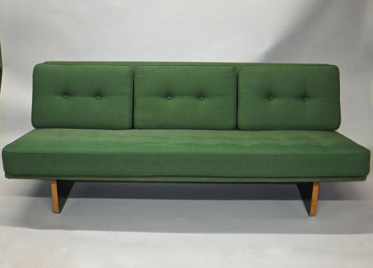 Three seat sofa Model #671 designed by Kho Liang Le in original condition that has a solid multiplex base finished with black laminate and green original fabric. The sofa has the original labels underneath