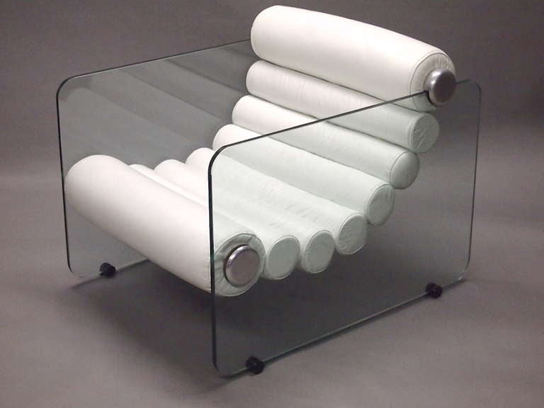 Hyaline Chair designed in 1967 by Fabio Lenci for Stendig comprised of two tempered glass sides supported by the seat cushion, of eight continus leather bolsters sewn together, connected to glass sides at top and bottom. The top of the bolster sits