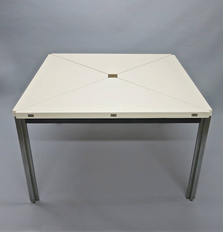 *SUMMER SALE*
T92 table in original off-white lacquer with a fantastic patina, was designed in 1960 by Eugenio Gerli and Mario Crisitiani and was awarded as a winning design in 1970. This table is square in shape, has a top that can rotate over the