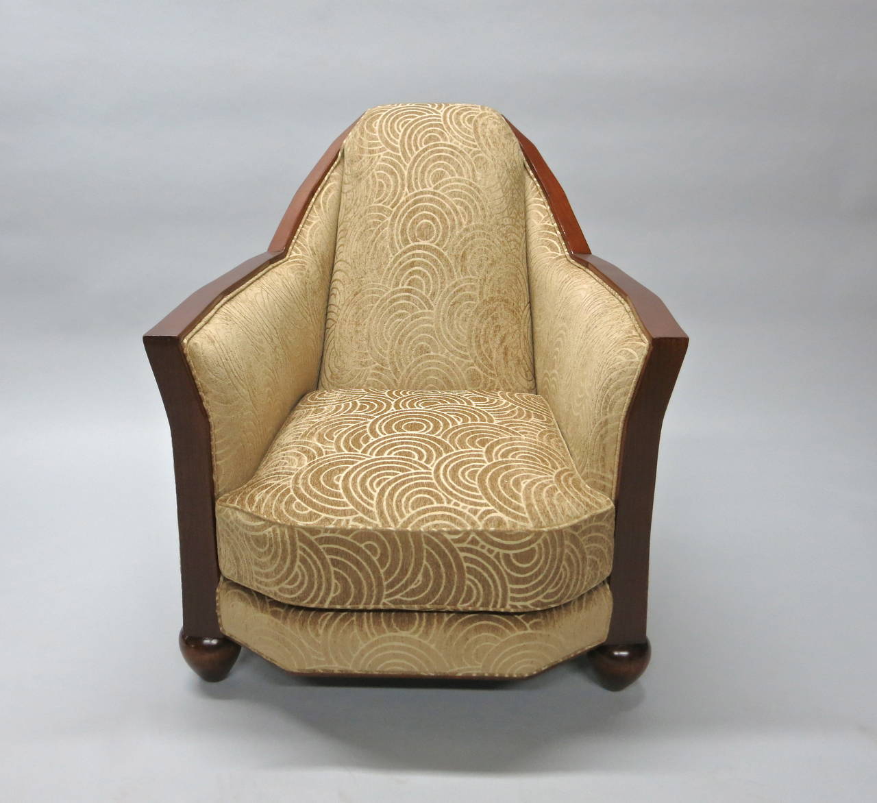 Early 20th century Art Deco wood trimmed chair with two rounded legs in the front, recently reupholstered and refinished.