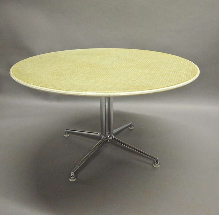 The La Fonda table was named after the 1960 restaurant "La Fonda del Sol" in New York City that Alexander Girard was hired to oversee in design (furniture, logos, dinnerware, etc.). 
This early edition table has a top of molded fiberglass
