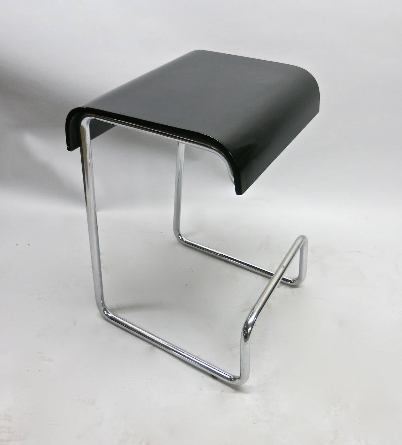 Set of six stools in tubular chrome and thick bentwood seats with a black lacquer finish.