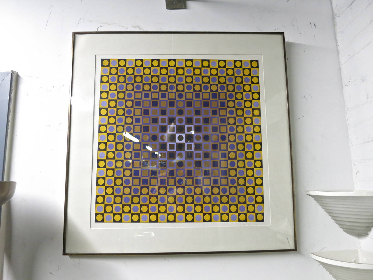 Purple and yellow print by Vasarely with circles in squares multicolored purple center.