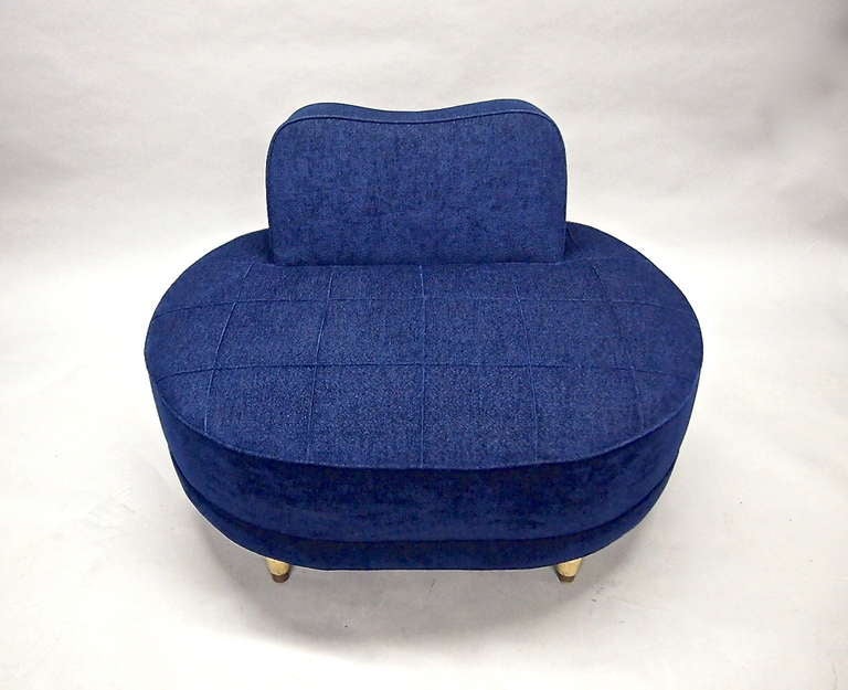 Single vintage 1930's settee/love seat with four tapered wooden legs, each with a brass sabot. Has been reupholstered in a blue textured fabric.